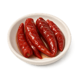 Red Sichuan pickled chillies with a small amount of clear brine in an ivory ceramic condiment dish on a pure white background.