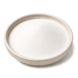 Fine silky matte-white starch powder in a low warm off-white ceramic condiment dish on a pure white background.