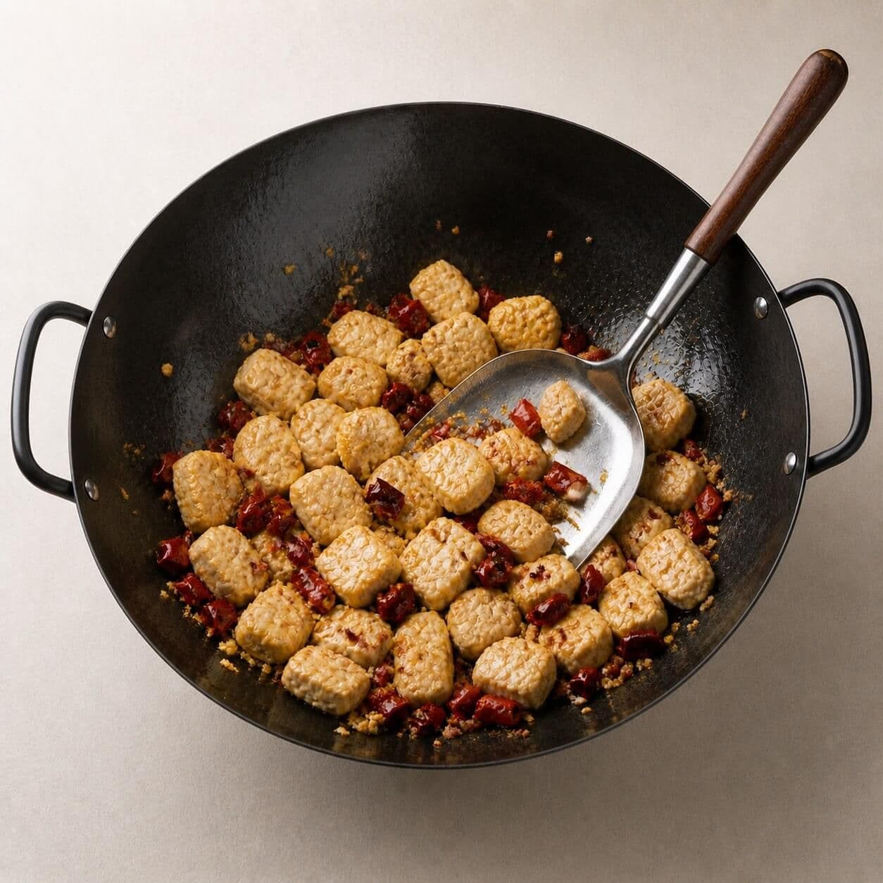 Bloom the spices and return the chicken